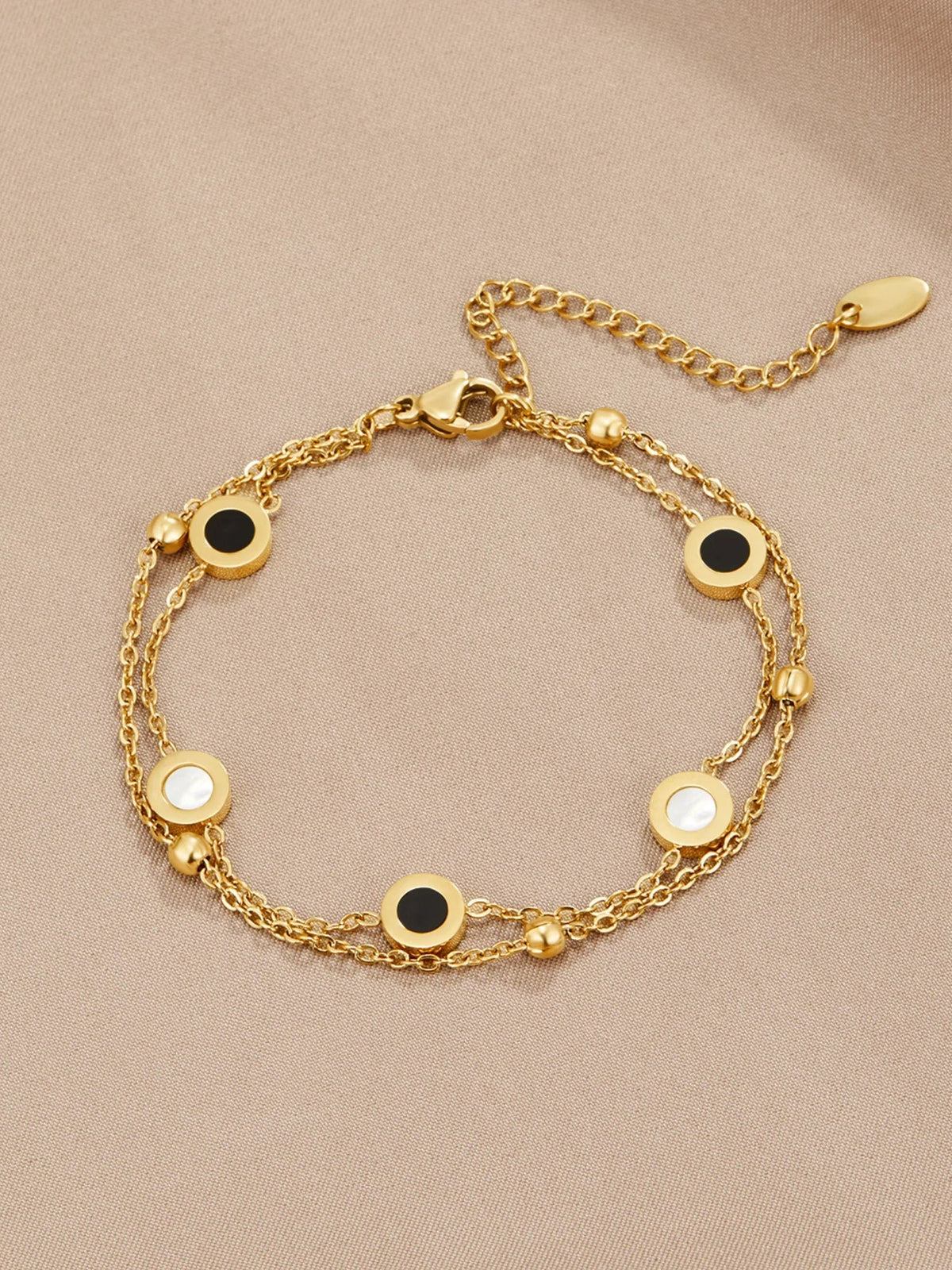 Ursula | Armband med onyx och vit sten, guld